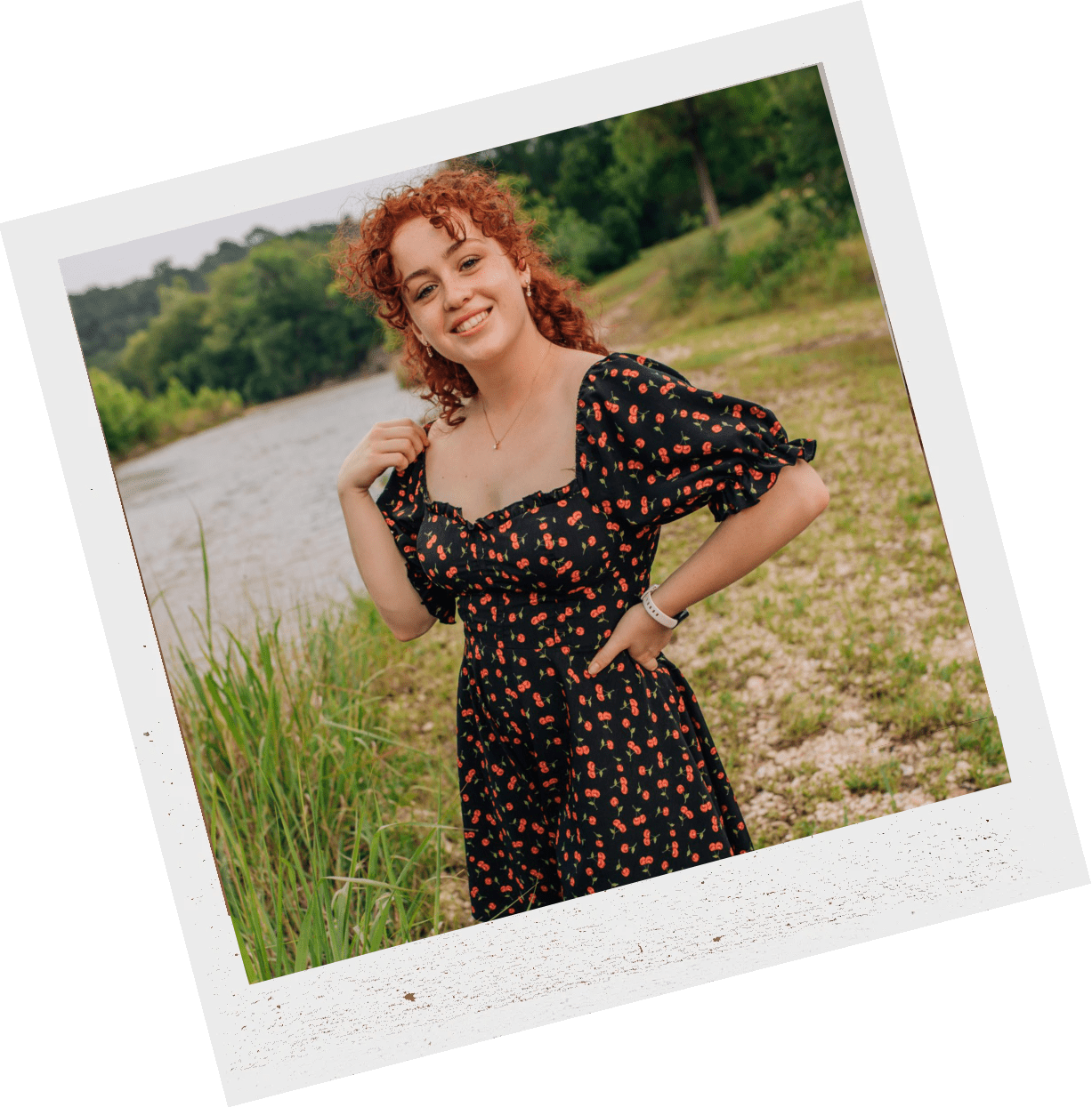 Young woman posing and smiling in nature
